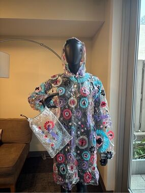 Multi colored rain coat and matching bag